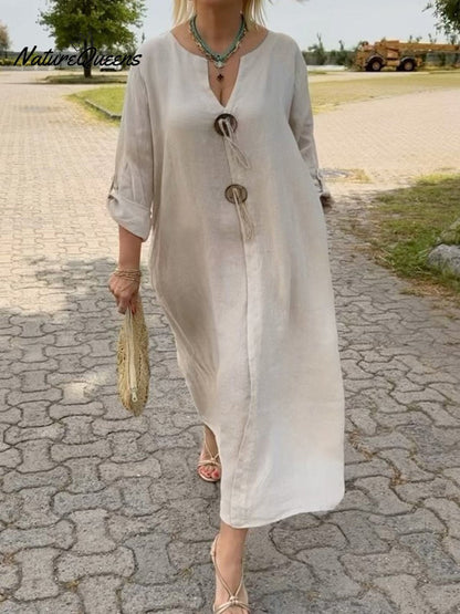 Noor – Lange jurk met houten details en losse mouwen